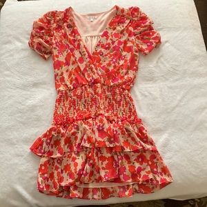 Mini pink floral dress, scrunching waits, v neck. Size medium.